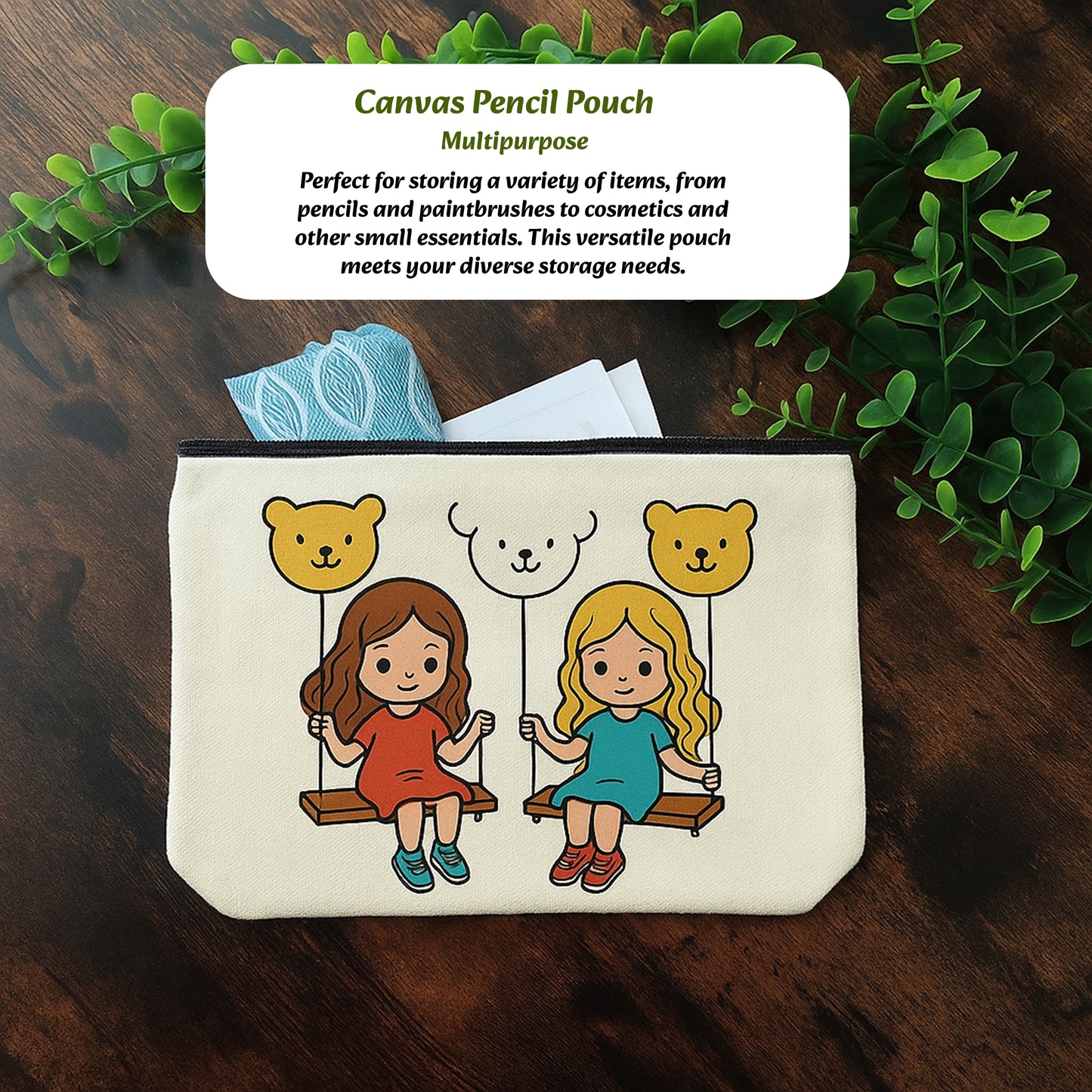 Canvas pencil pouch with cartoon design of two girls on swings and bears above, on a wooden surface with greenery.