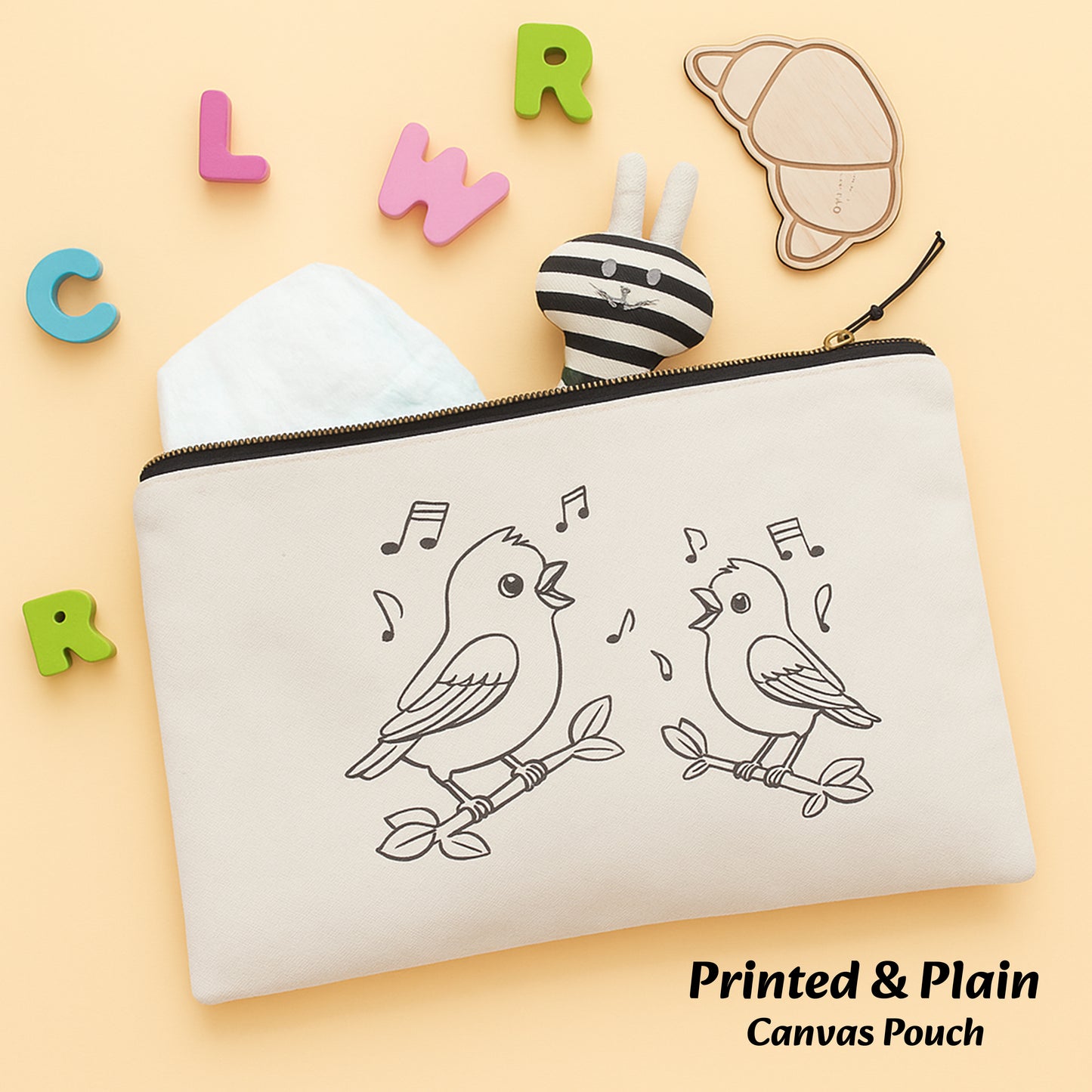 Canvas pouch with bird design on a beige background with colorful letters and a bee toy.