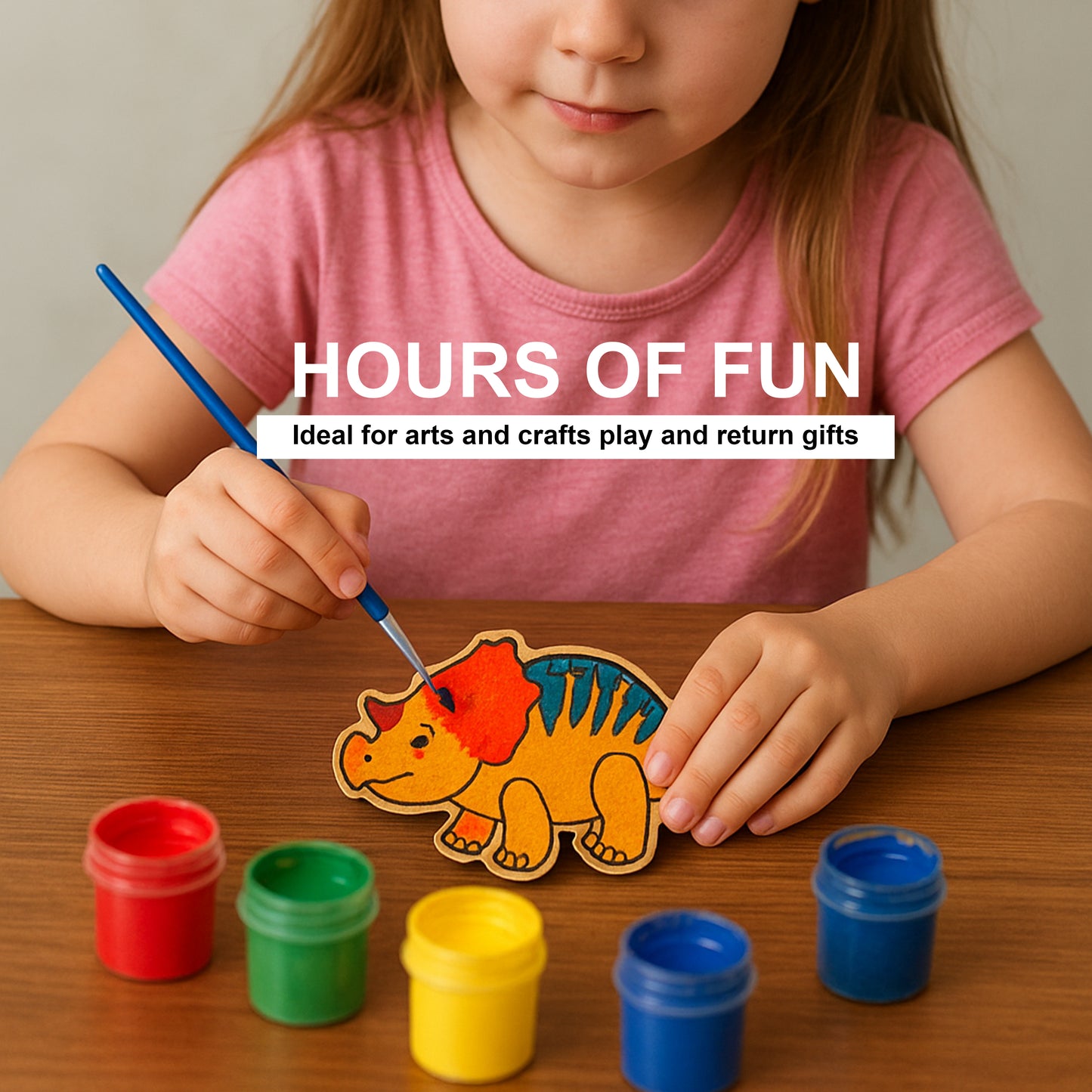 Child painting a dinosaur-shaped craft with colorful paint cans on a wooden table.