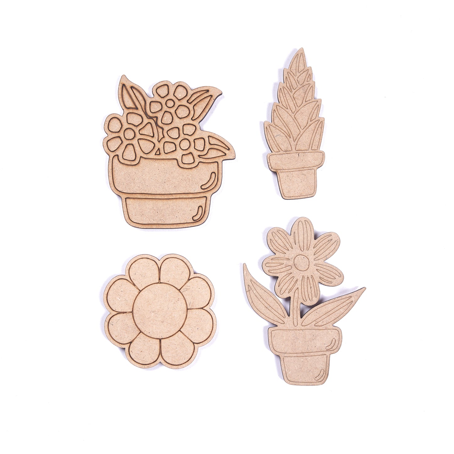 Set of wooden plant-shaped cutouts on a white background