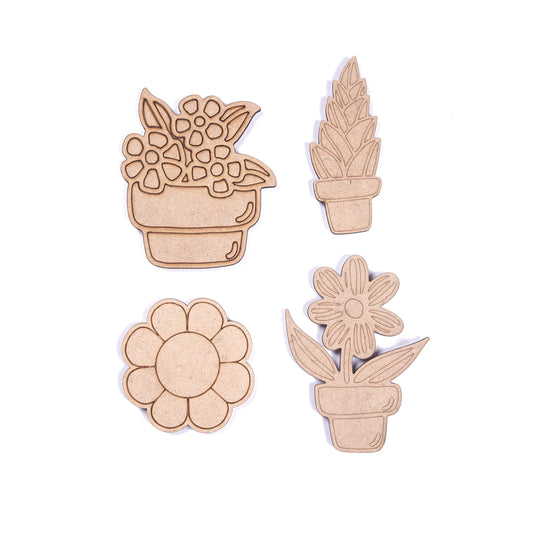 Set of wooden plant-shaped cutouts on a white background