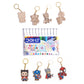 Set of watercolor pens with keychains on a white background