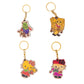 Four colorful keychains featuring cartoon characters on a white background