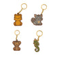 Four animal-themed keychains on a white background