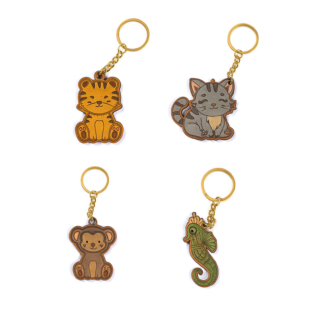 Four animal-themed keychains on a white background