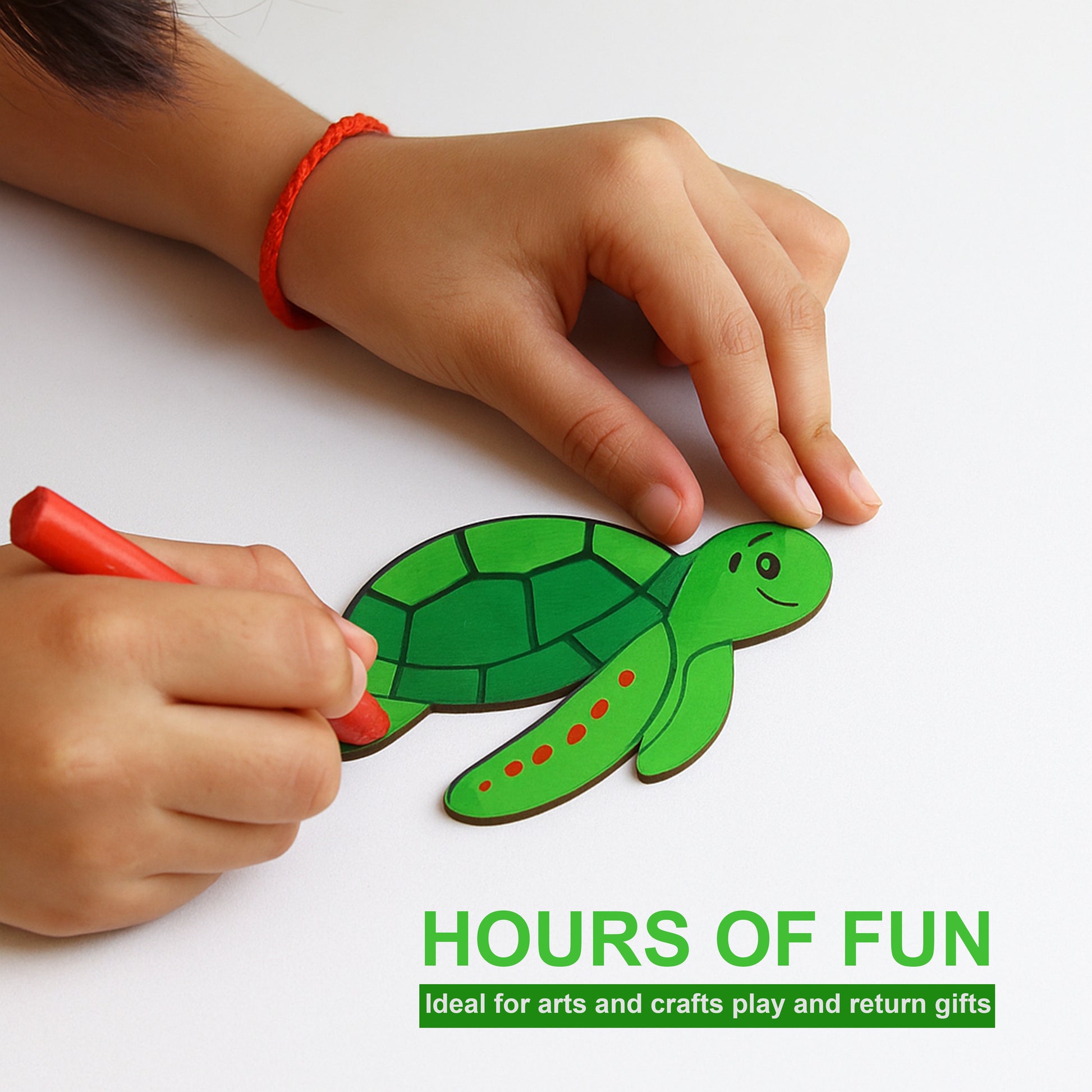 Child's hands coloring a green turtle drawing with red marker on a white background.