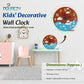 Decorative wall clock for kids with Pourezy branding, shown in a room setting.